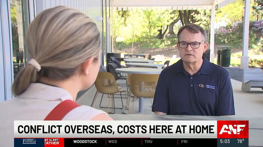Chris Gaffney on right being interviewed by Abby Kousouris on left from Atlanta News First in an outside setting on the Georgia Tech campus.
